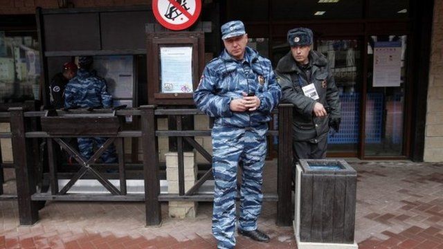 Russian police officers guard an entrance of a cableway in Krasnaya Polyana, mountain Olympic cluster