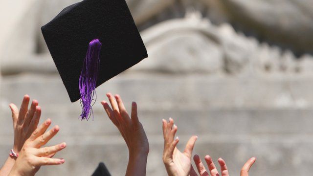 Graduates throw up hats
