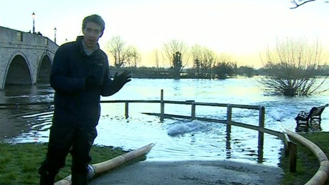 Nick Beake stood by an overflowing Thames in Chertsey