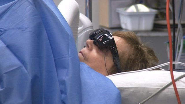 Woman wearing video goggles