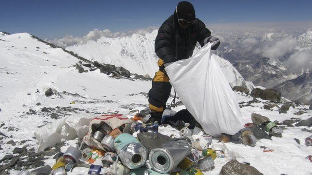 Sherpa picks up rubbish on Mount Everest