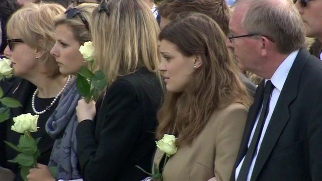 Mourners watching a cortege