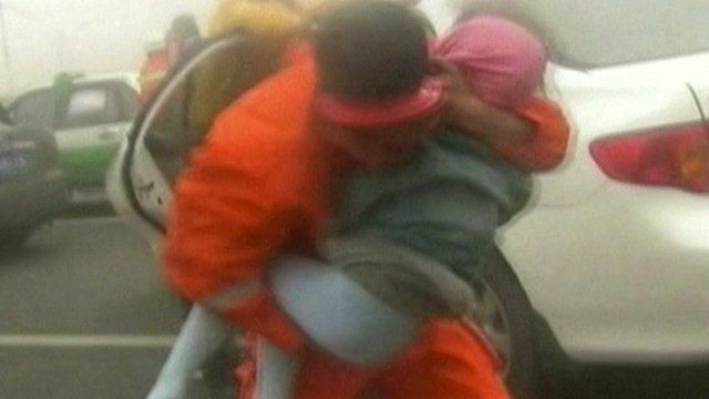 Rescuer carrying child