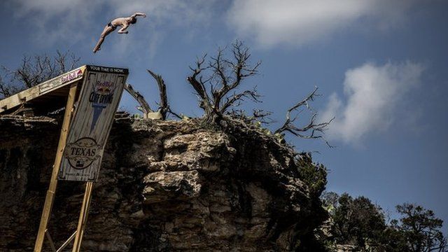 Diver Dave Hunt jumps off a diving board