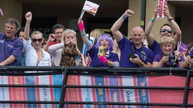 People cheering the arrival of the Clipper race on the River Foyle