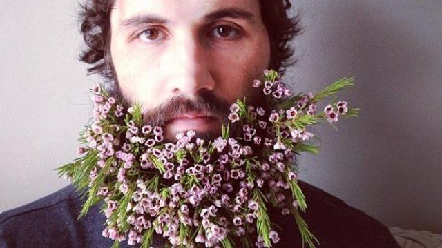 man with flowers in his beard