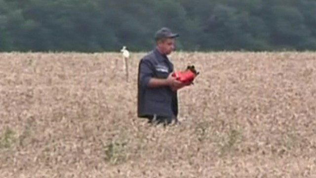 A man carrying the black box