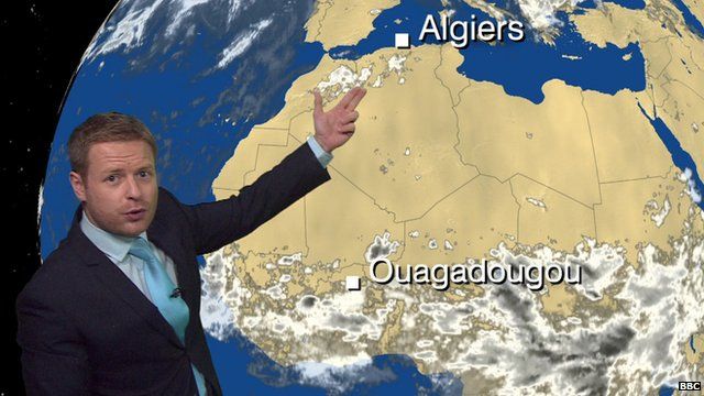 BBC Weather's Tomasz Schafernaker in front of a weather satellite image of Africa