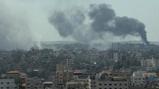 smoke rises on horizon