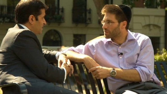 Asad Ahmad (left) with Rabbi Natan Levy