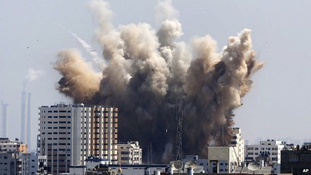 Smoke, dust and debris rise over Gaza City after an Israeli strike