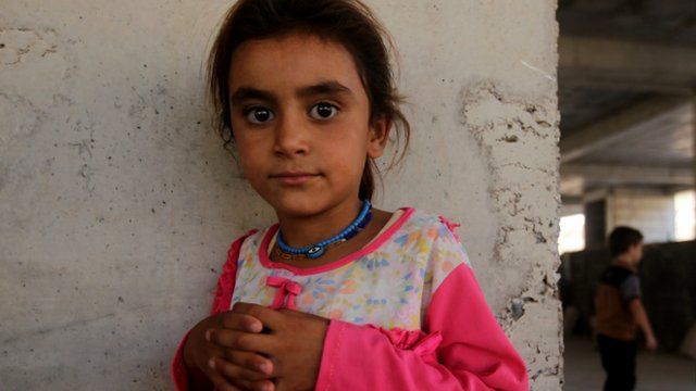 A girl that has fled her home in Iraq