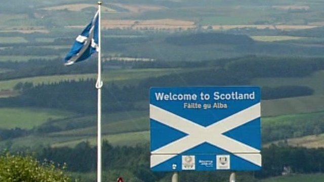 Saltire and Welcome to Scotland sign