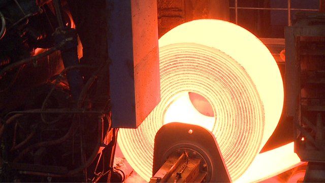 Close up of roll of heated steel at steelworks in eastern German town of Eisenhuttenstadt