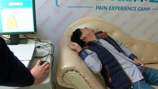 Man on couch receiving electric currents