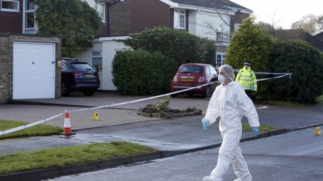 Police at the scene in Fetcham, Surrey