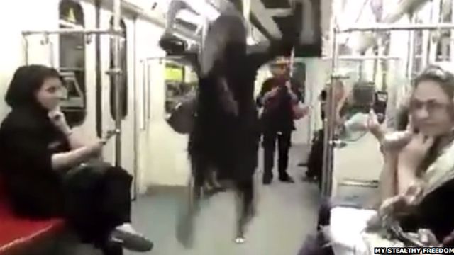 Woman dancing on Tehran Metro