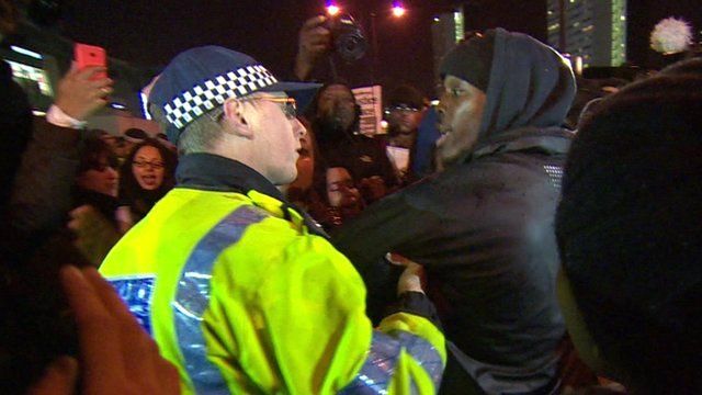 Policeman and protester outside Westfield Shopping Centre, London