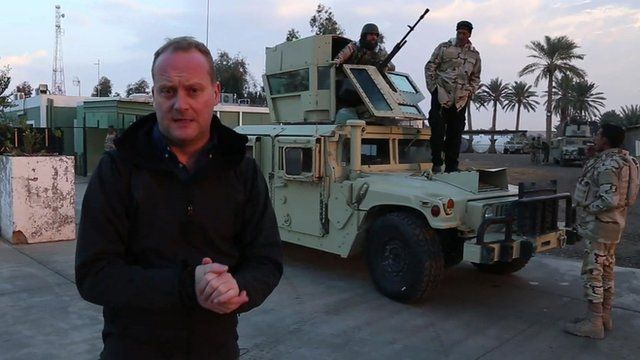 Quentin Sommerville in front of military vehicle at Ain al-Asad airbase