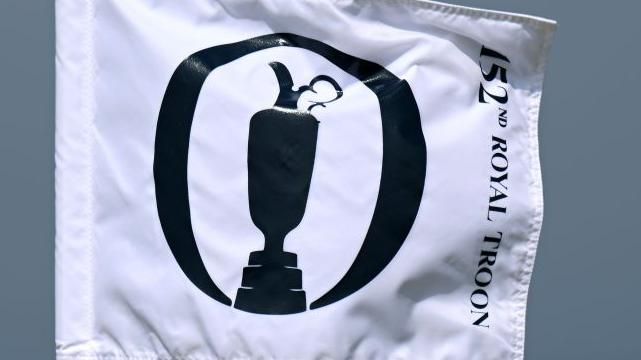 A flag with The Open logo