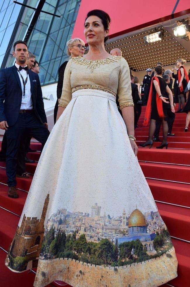 Israeli Culture Minister Miri Regev wearing a dress featuring the old city of Jerusalem arrives on May 17, 2017 for the screening of the film "Ismael"s Ghosts" during the opening ceremony of the 70th edition of the Cannes Film Festival in Cannes, southern France
