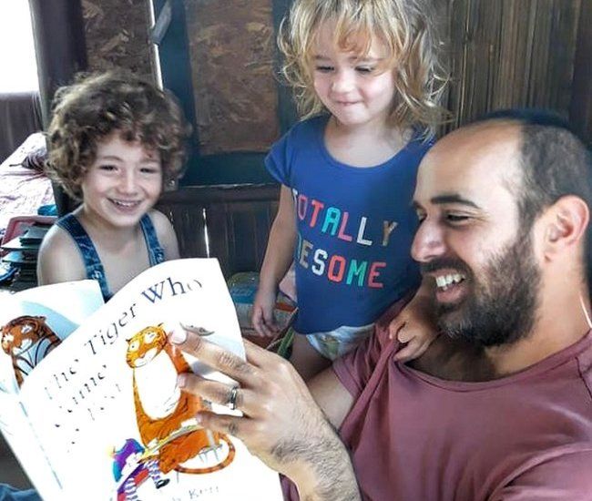 Yair reading to kids