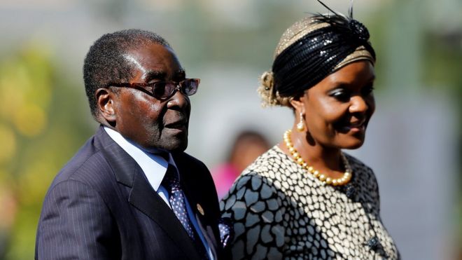 Zimbabwean President Robert Mugabe (L) with his wife Grace in a file photo taken in South Africa in 2014