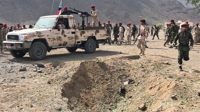 Yemeni security forces rush to the scene of a missile attack on a military camp west of Yemen's government-held second city Aden (file photo)
