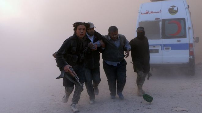 Men helping a wounded man escape