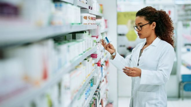 A pharmacist sorting medicines