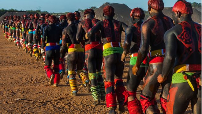 Young men participate in the martial art called Huka-huka