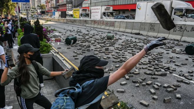 Protestors throw bricks to the road in Wong Tai Sin district on November 11, 2019 in Hong Kong, China.