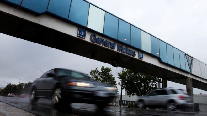 Cars pass under an overpass at the General Motors Car assembly plant in Oshawa, June 1, 2012.