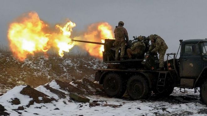 Ukrainian soldiers fire an anti-aircraft gun at a position near Bakhmut in Donetsk on 4 February