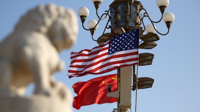 Chinese and American national flags fly on Tian'anmen Square to welcome U.S. President Donald Trump on November 8, 2017 in Beijing, China.