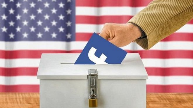 Рука, опускающая символ Facebook в избирательную урну