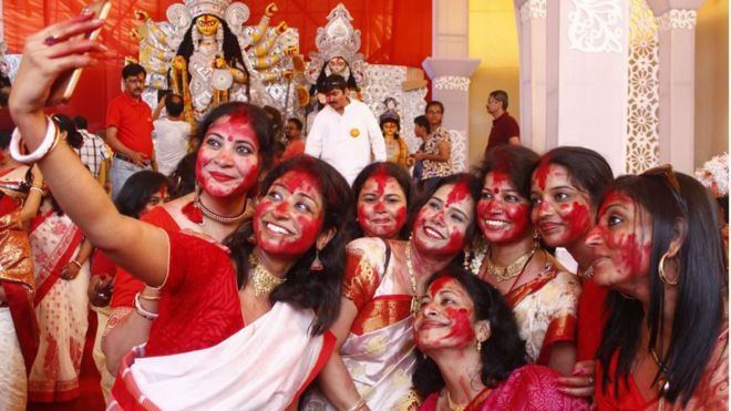 Hindu Bengali women take a selfie in Gurugram near Delhi.