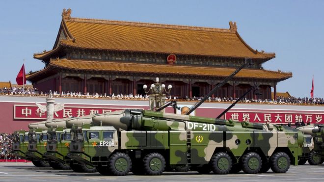 Chinese military vehicles carrying DF-21D anti-ship ballistic missiles, potentially capable of sinking a U.S. Nimitz-class aircraft carrier in a single strike, travel past Tiananmen Gate during a military parade to commemorate the 70th anniversary of the end of World War II in Beijing Thursday Sept. 3, 2015.