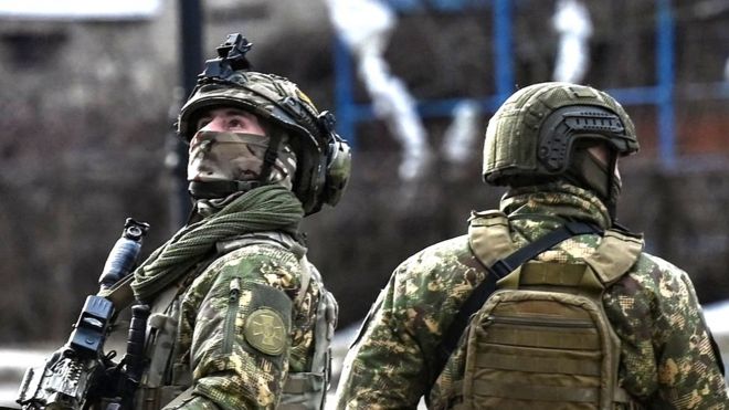 Ukrainian troops patrol in the town of Novoluhanske, eastern Ukraine, on February 19, 2022.