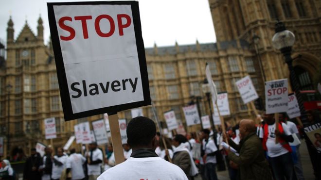 Anti-slavery activists rally outside Parliament, in London