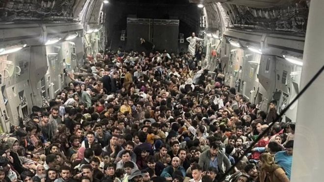 Picture provided Defense One appears to show hundreds of Afghans fleeing Kabul onboard an American C-17 cargo plane, 15 August 2021