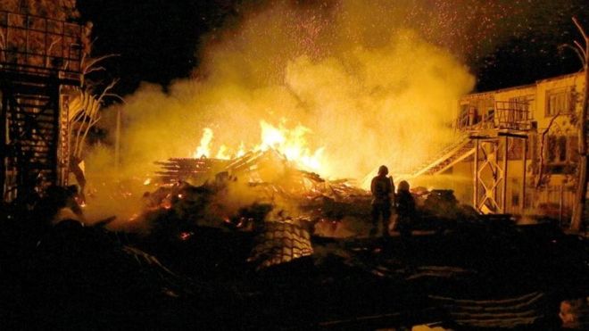 Firefighters work to extinguish a fire at a children's camp on 16 September 2017 in Odessa.