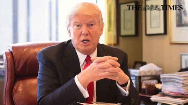 Photo showing Mr Trump behind his desk during his interview with The Times.
