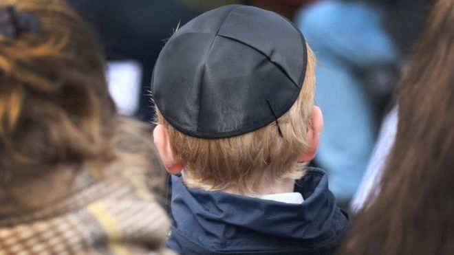 A young man wears a kippa in Bergen-Belsen, northern Germany. Photo: 18 April 2018