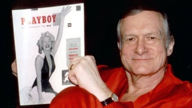 Playboy founder Hugh Hefner with the first copy of the magazine. File photo