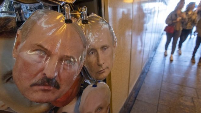 Masks of Belarus President Alexander Lukashenko (L) and Russian President Vladimir Putin displays on the street souvenir market in St. Petersburg, Russia, 15 August 2020.