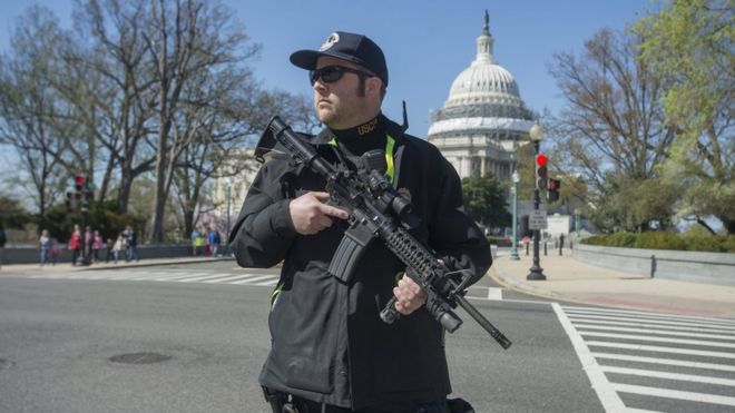 USCP officer with Capitol Building