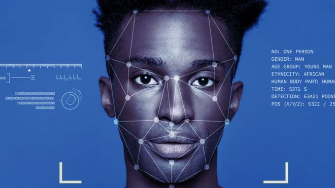 Man with facial recognition software superimposed.