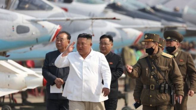 Kim Jong-un (centre) inspects North Korea's Air Force units on 12 April 2020