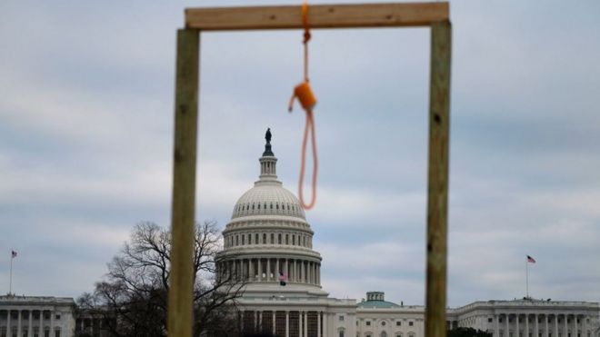 A noose is seen on makeshift gallows as supporters of US President Donald Trump gather on the West side of the US Capitol in Washington DC